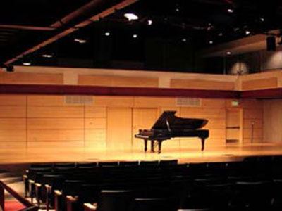 The stage in the Broomfield Auditorium with a piano